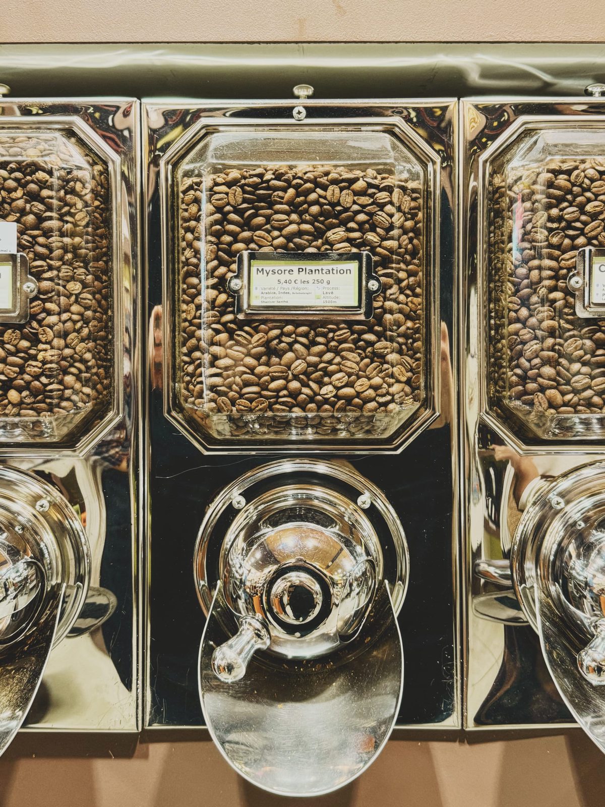 A coffee bean dispenser at a small-scale roaster. Image Anthony Nelzin-Santos.