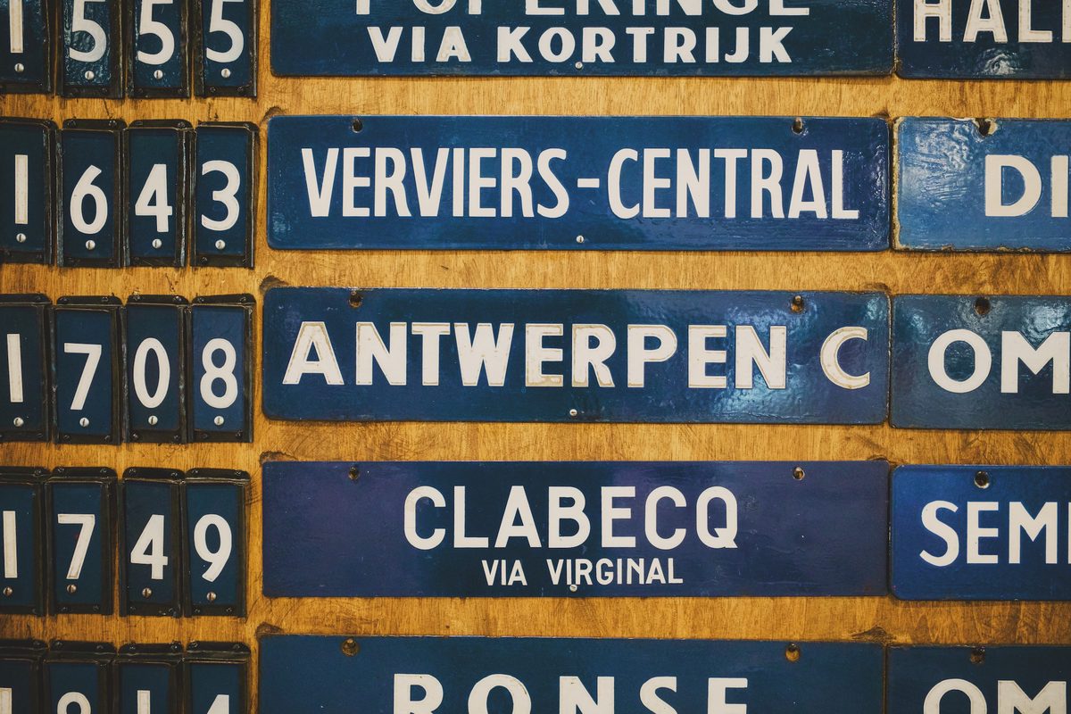 A vintage departure board featuring a train to Antwerpen at Train World. Image Anthony Nelzin-Santos.