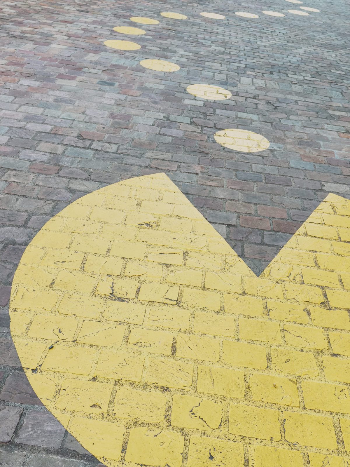 A painting of Pacman on the pavement. Image Anthony Nelzin-Santos.
