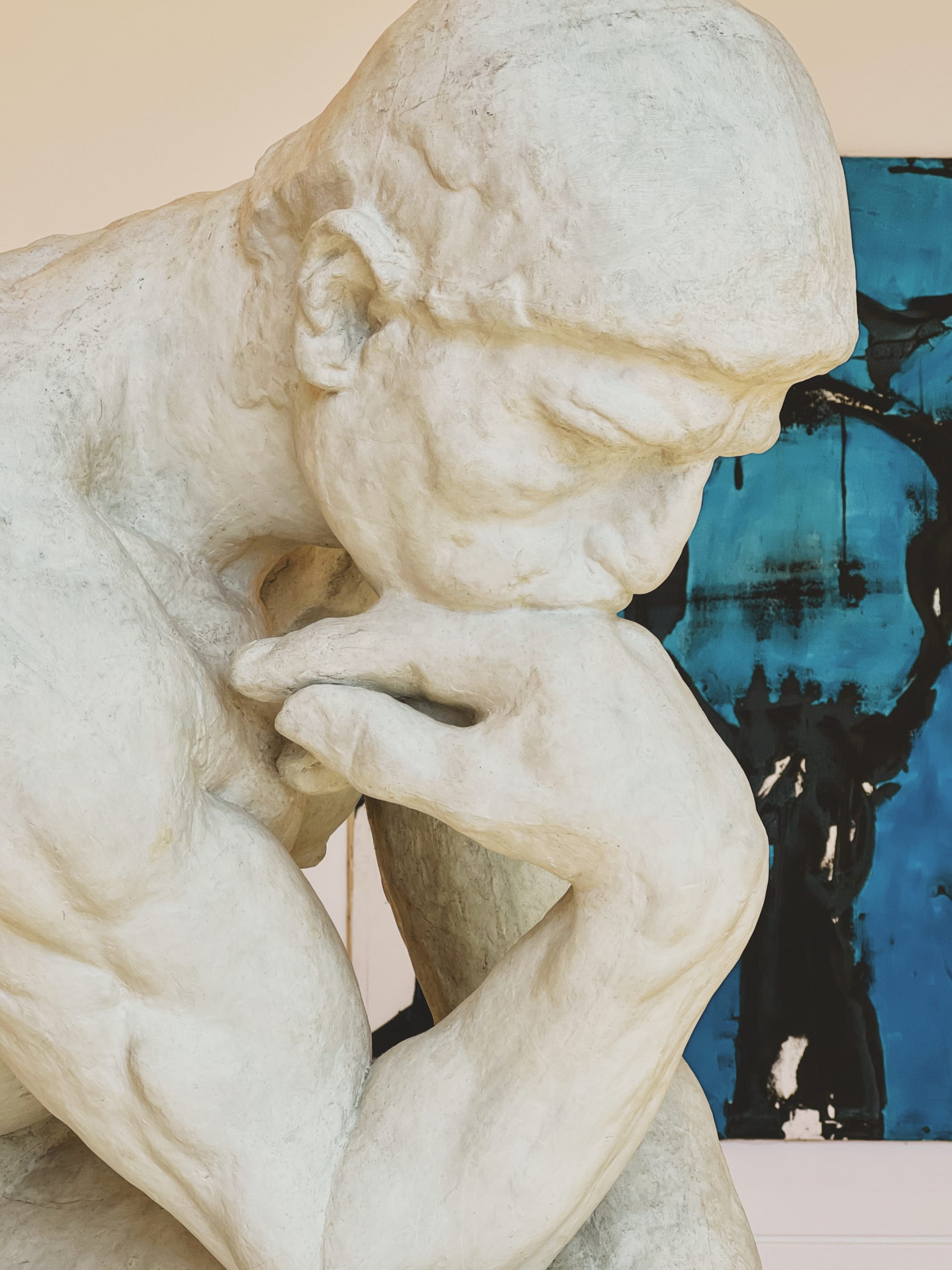 A muscular statue in a museum.