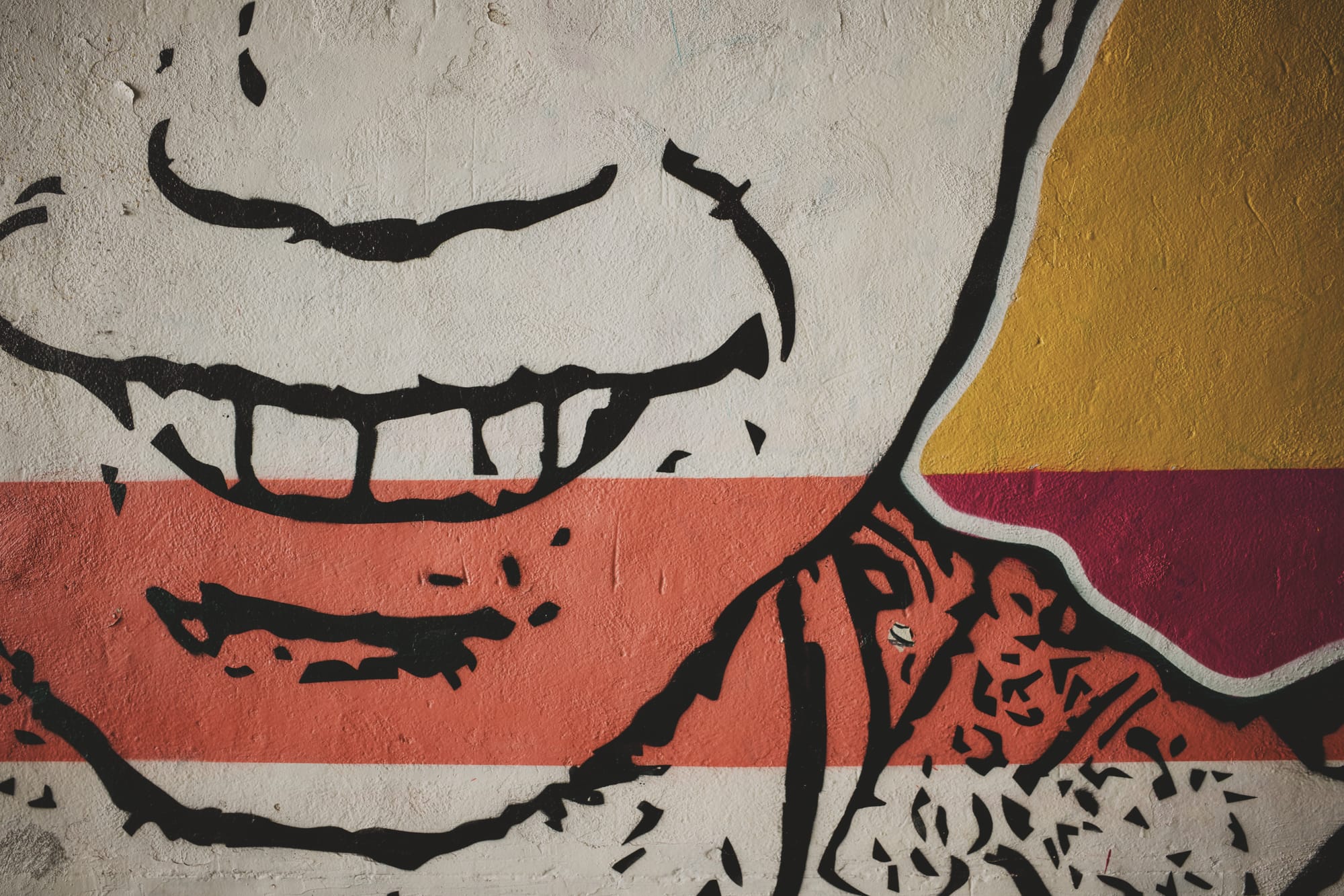 A mural of a smiling child. Image Anthony Nelzin-Santos