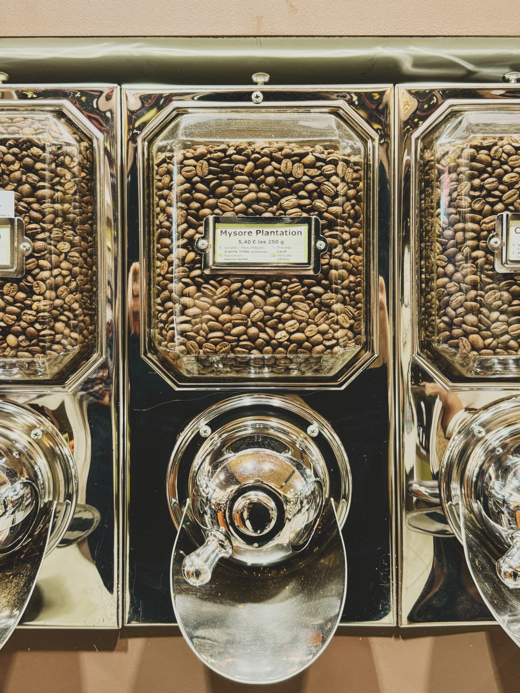 A coffee bean dispenser at a small-scale roaster. Image Anthony Nelzin-Santos