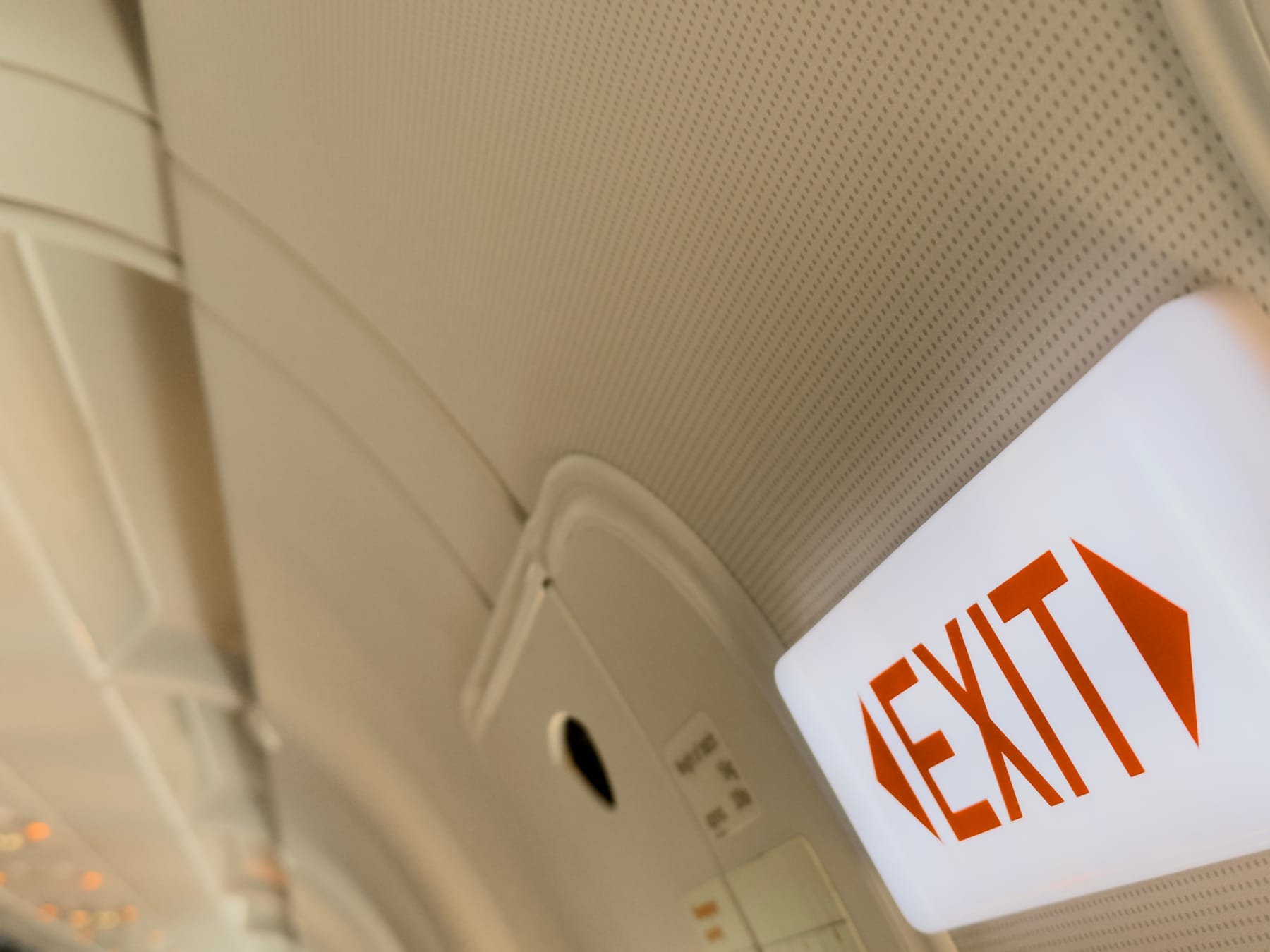 An exit sign on a plane.