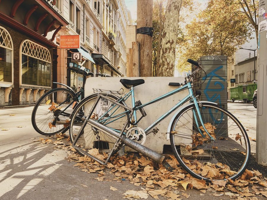 A bunch of old bikes on the street.