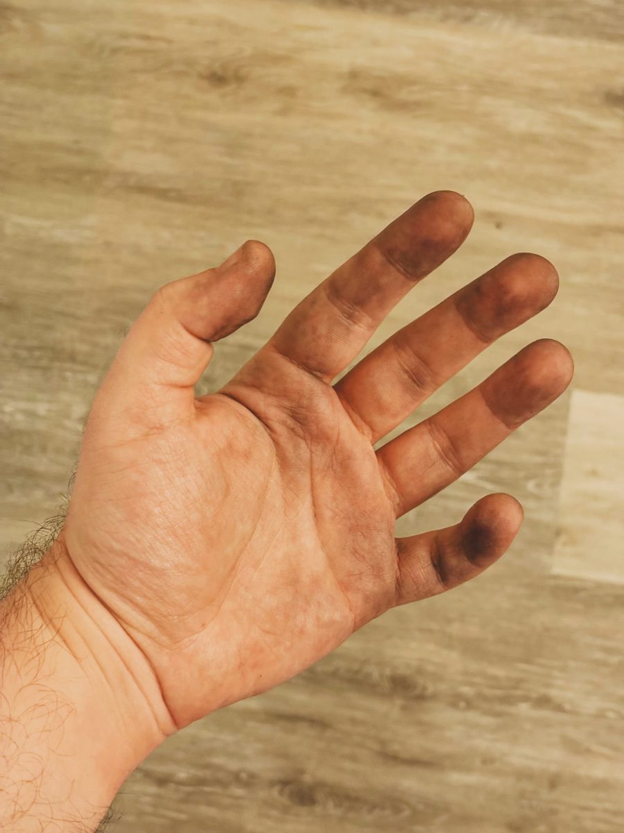 My hand covered with metal dust.
