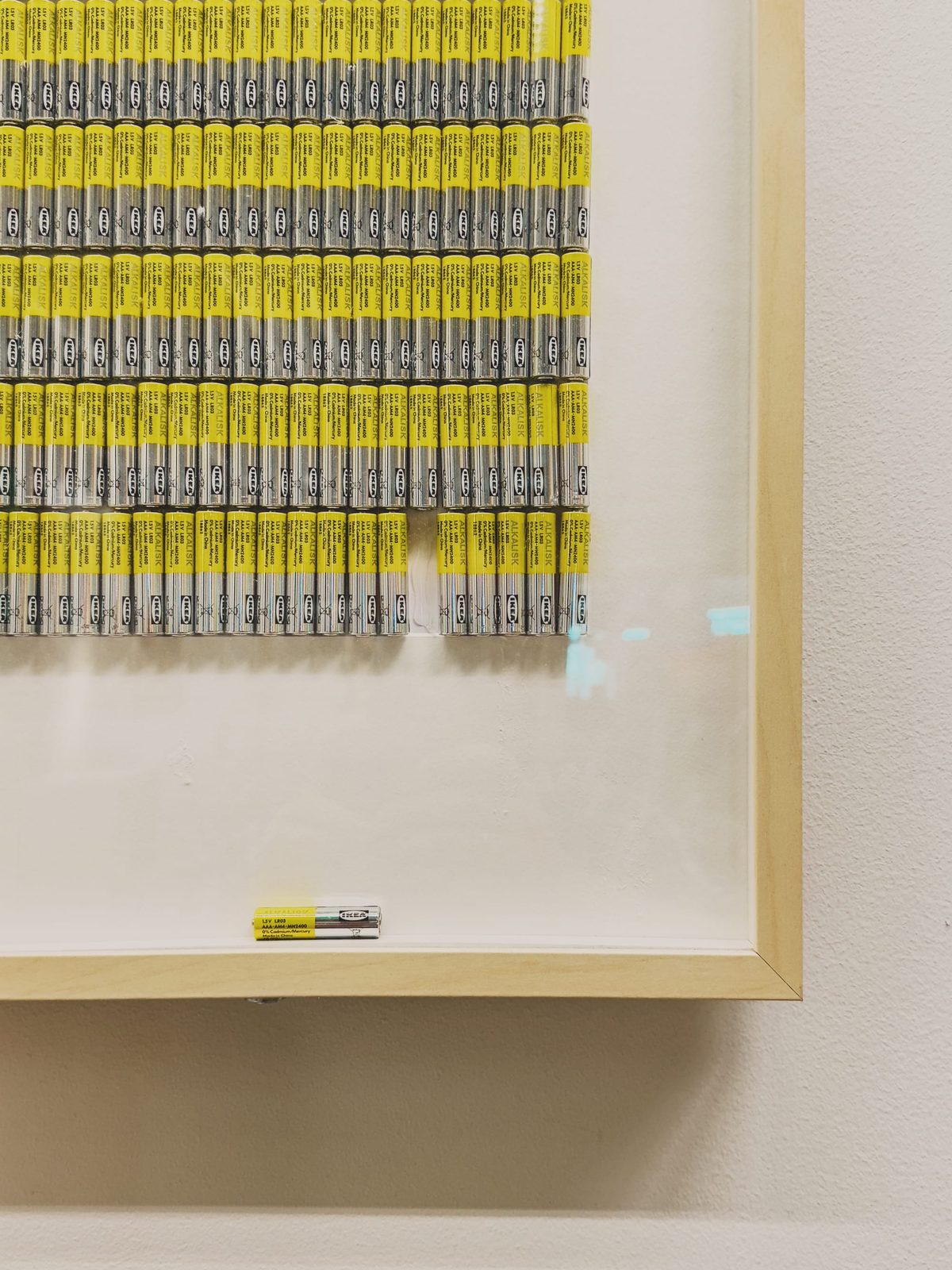 A lone battery that’s fallen down from a row of batteries in some sort of art installation in an IKEA store. Image Anthony Nelzin-Santos.