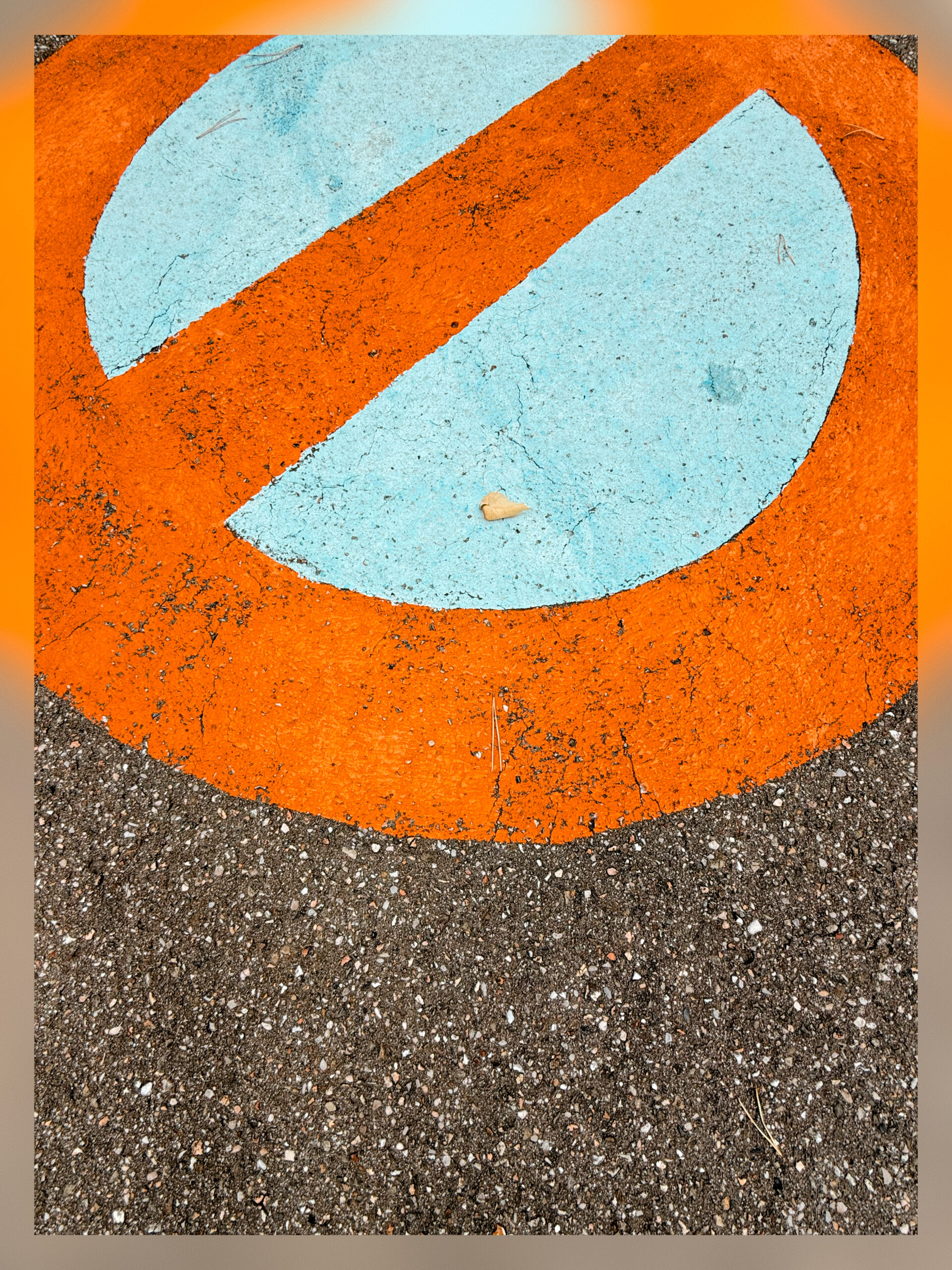 A do not park sign spray painted on the tarmac.