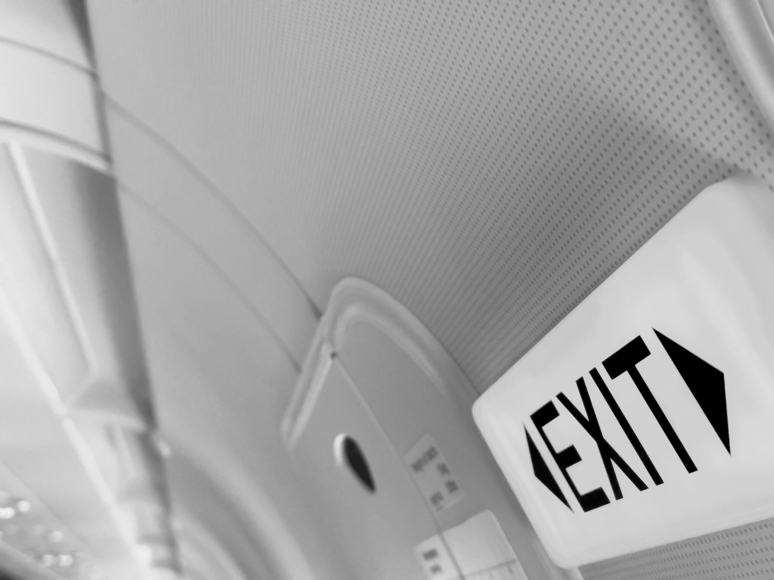 An exit sign in a plane.