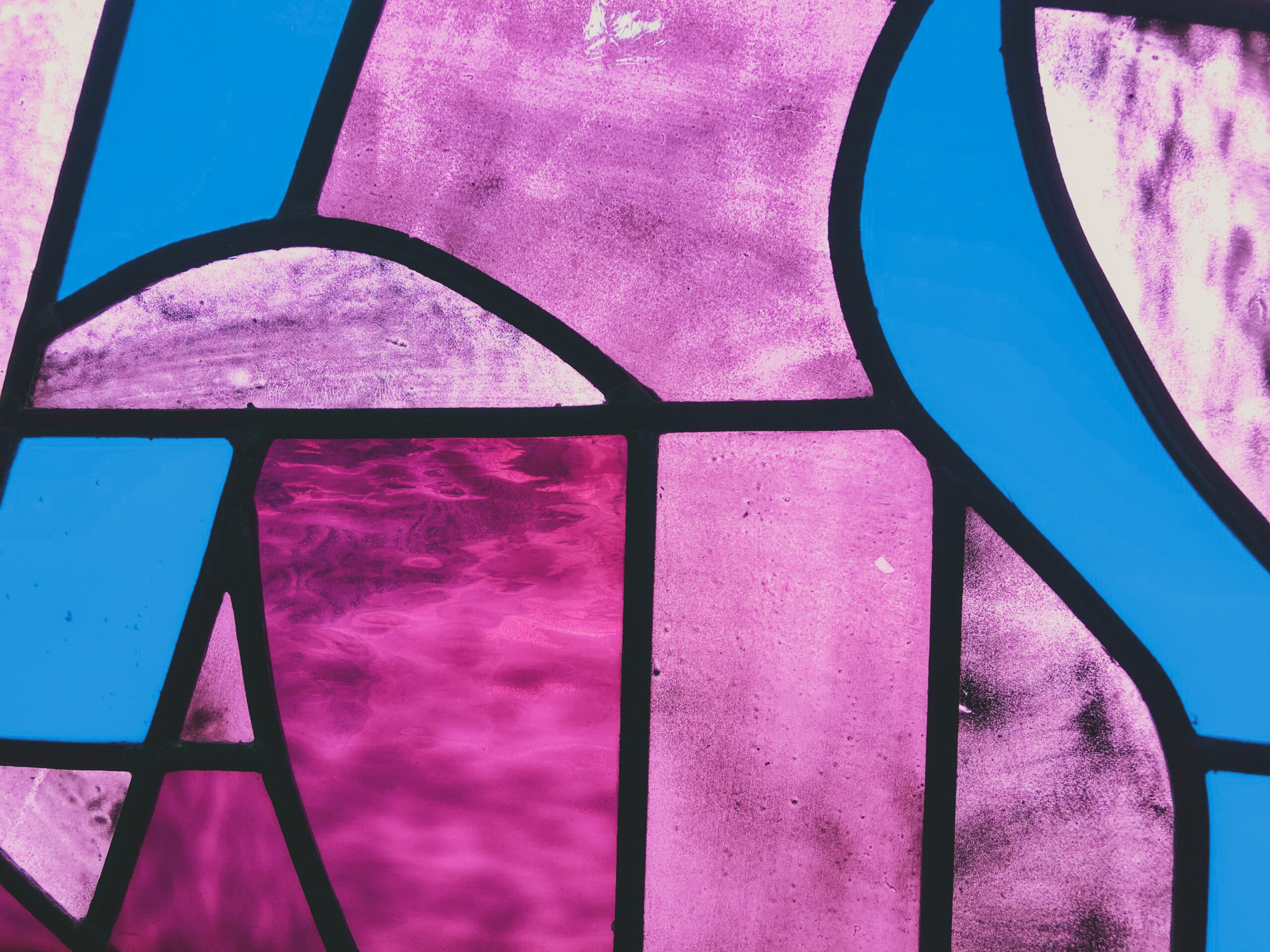 A purple, blue and pink stained glass.