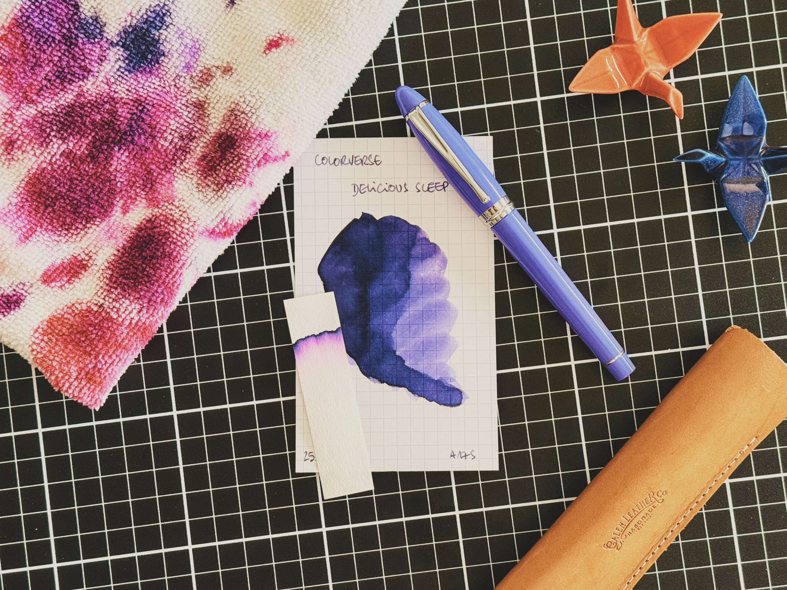 A fountain pen and an ink swatch.